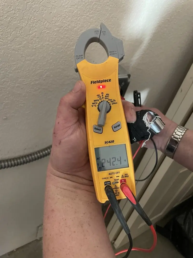Voltage testing with clamp meter during Recessed Lighting Installation in Timber Pines